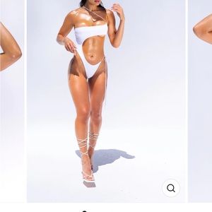 Brand new white one piece. Never worn never taken out of package. Great material